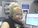 Misti Flowers smiling at her desk
