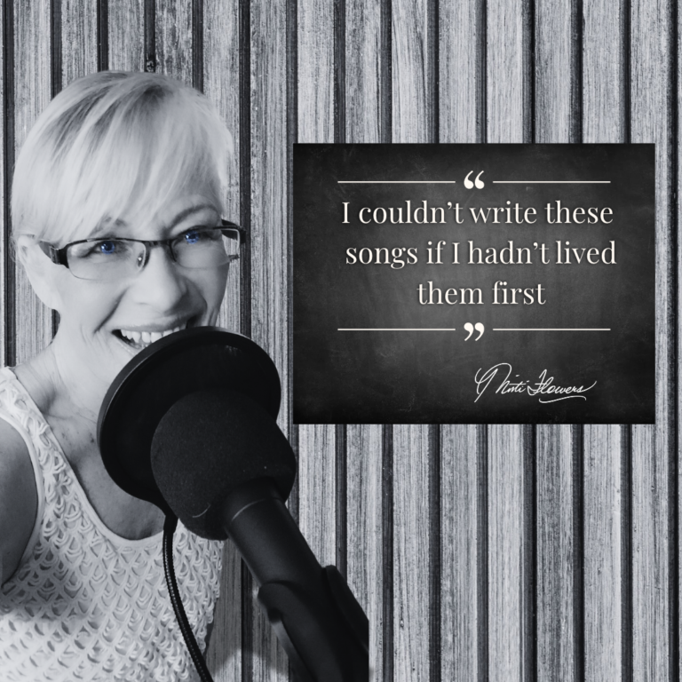 Misti Flowers behind a microphone in black and white